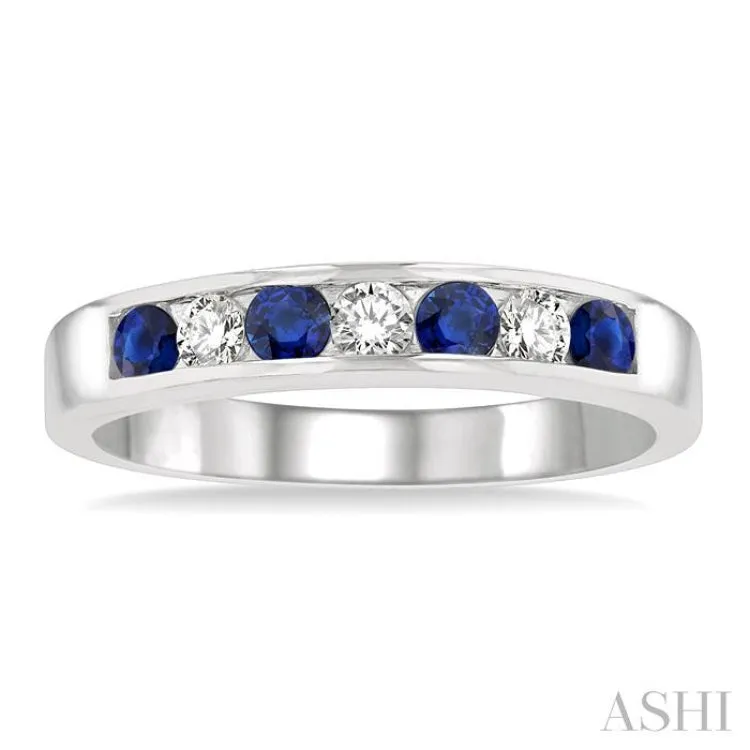 1/5 Ctw Channel Set Round Cut Diamond and 2.5 MM Round Cut Sapphire Band in 14K White Gold